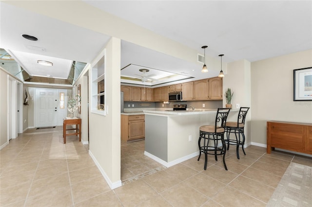 1750 Jamaica Way Unit 312, Punta Gorda, FL 33950 - kitchen with light tile patterned flooring, light countertops, a peninsula, appliances with stainless steel finishes, and visible vents
