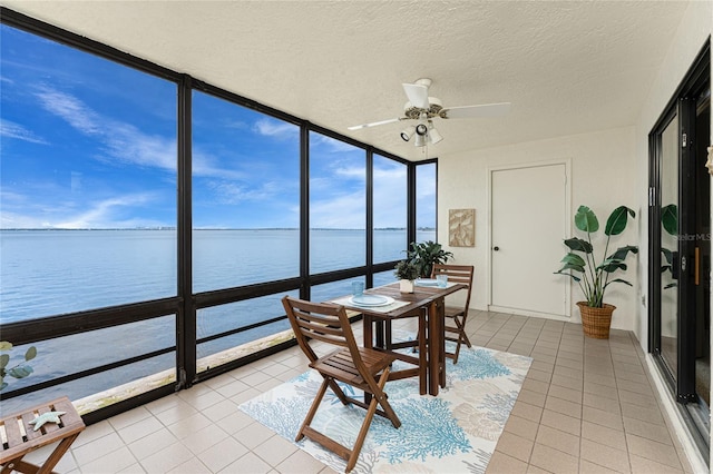 1750 Jamaica Way Unit 312, Punta Gorda, FL 33950 - sunroom featuring floor to ceiling windows, tile patterned flooring, a textured ceiling, and a water view