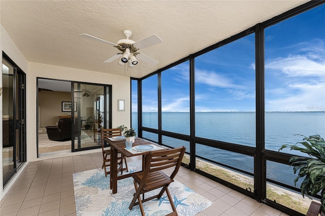 1750 Jamaica Way Unit 312, Punta Gorda, FL 33950 - sunroom / solarium with expansive windows, a ceiling fan, tile patterned floors, and a water view