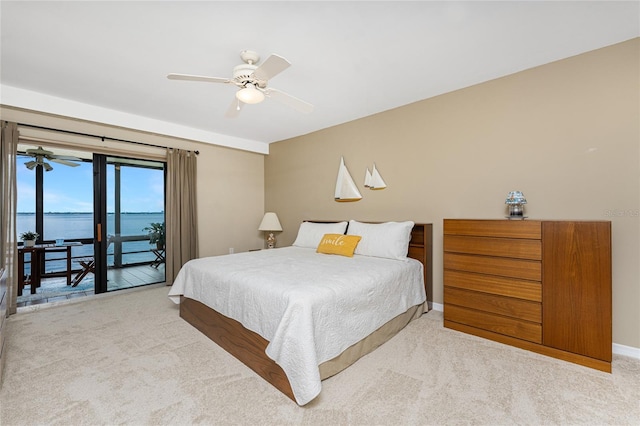 1750 Jamaica Way Unit 312, Punta Gorda, FL 33950 - carpeted bedroom with access to exterior, baseboards, ceiling fan, and a water view
