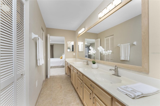 1750 Jamaica Way Unit 312, Punta Gorda, FL 33950 - ensuite bathroom featuring double vanity, a closet, tile patterned floors, and a sink