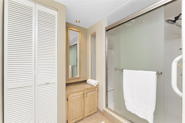 1750 Jamaica Way Unit 312, Punta Gorda, FL 33950 - bathroom featuring a shower stall, a closet, and tile patterned flooring
