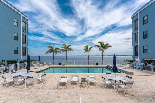 1750 Jamaica Way Unit 312, Punta Gorda, FL 33950 - pool with fence, a water view, and a patio area