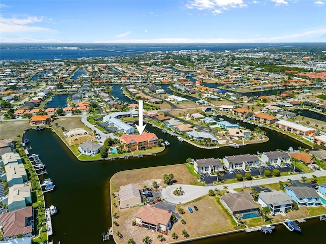 bird's eye view featuring a water view and a residential view