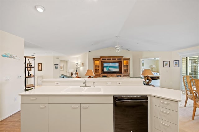 kitchen with ceiling fan, dishwasher, a sink, light countertops, and open floor plan
