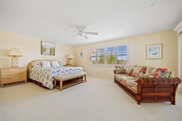 bedroom featuring baseboards, ceiling fan, and carpet
