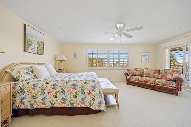 bedroom featuring carpet floors, multiple windows, and a ceiling fan