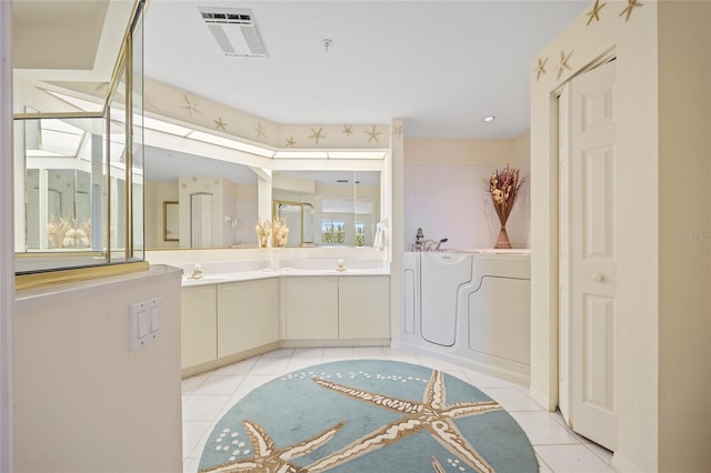 full bath with visible vents, a bath, tile patterned floors, and vanity