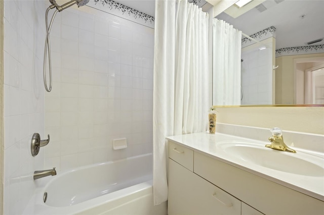 bathroom with vanity and shower / tub combo