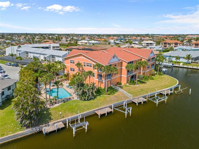 bird's eye view with a water view and a residential view