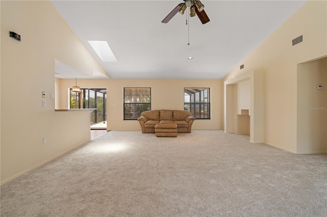 453 Carolyn Ln, Punta Gorda, FL 33950 - living area featuring carpet floors, a ceiling fan, lofted ceiling with skylight, and visible vents