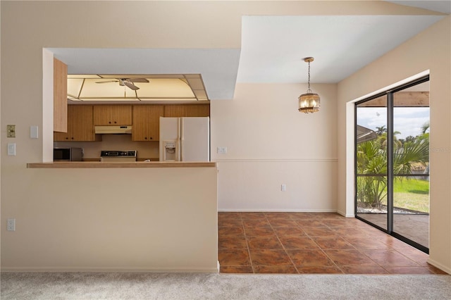 453 Carolyn Ln, Punta Gorda, FL 33950 - kitchen with ceiling fan, white refrigerator with ice dispenser, stove, baseboards, and under cabinet range hood