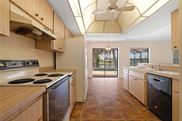 453 Carolyn Ln, Punta Gorda, FL 33950 - kitchen with black dishwasher, white electric range, light countertops, under cabinet range hood, and a sink
