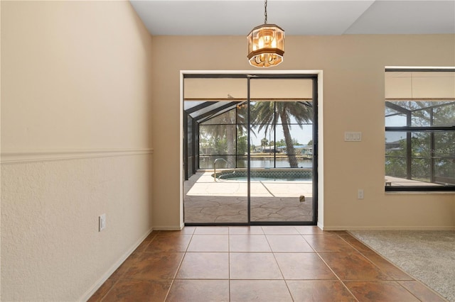453 Carolyn Ln, Punta Gorda, FL 33950 - entryway featuring a water view and an inviting chandelier