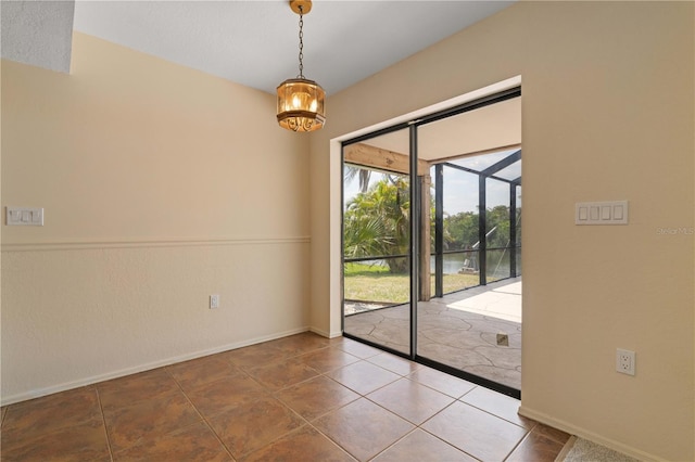 453 Carolyn Ln, Punta Gorda, FL 33950 - interior space featuring baseboards, tile patterned floors, and a notable chandelier