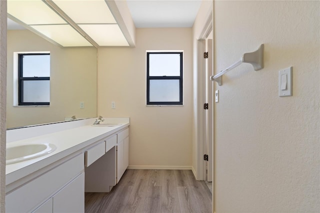 453 Carolyn Ln, Punta Gorda, FL 33950 - full bath featuring double vanity, baseboards, a sink, and wood finished floors