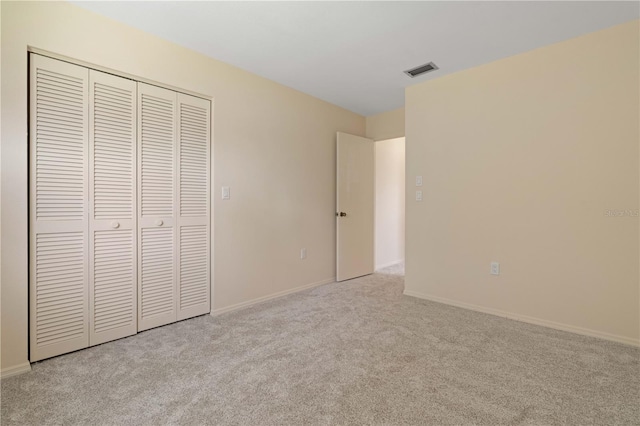 453 Carolyn Ln, Punta Gorda, FL 33950 - unfurnished bedroom with baseboards, visible vents, carpet, and a closet