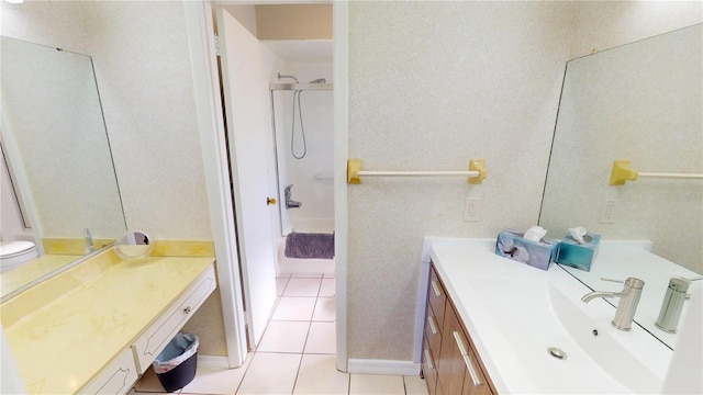 full bathroom with tile patterned floors and vanity