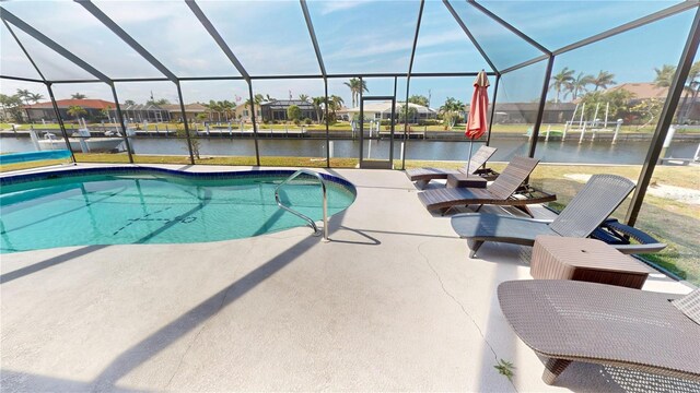 pool featuring a patio area, a lanai, a residential view, and a water view