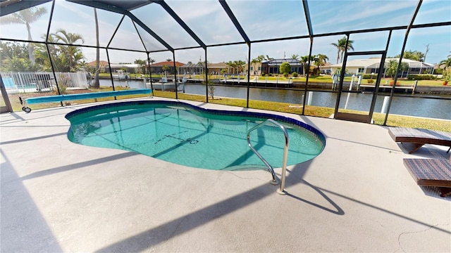 pool with glass enclosure, a residential view, a patio area, and a water view
