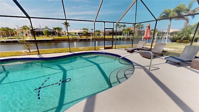 outdoor pool featuring a residential view, a water view, a patio area, and glass enclosure