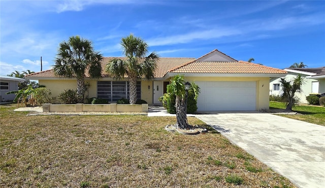 view of front facade with a front lawn, stucco siding, an attached garage, a tile roof, and driveway