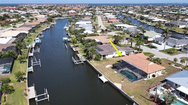 bird's eye view with a residential view and a water view