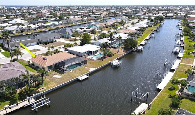 bird's eye view featuring a water view and a residential view