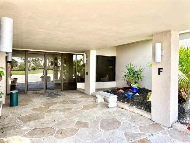 25188 Marion Ave Unit F304, Punta Gorda, FL 33950 - view of patio / terrace featuring french doors