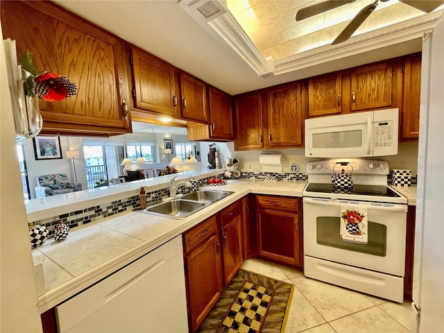 25188 Marion Ave Unit F304, Punta Gorda, FL 33950 - kitchen featuring a sink, light tile patterned floors, a ceiling fan, tile countertops, and white appliances