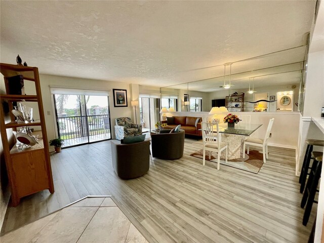 25188 Marion Ave Unit F304, Punta Gorda, FL 33950 - living area with wood finished floors and a textured ceiling