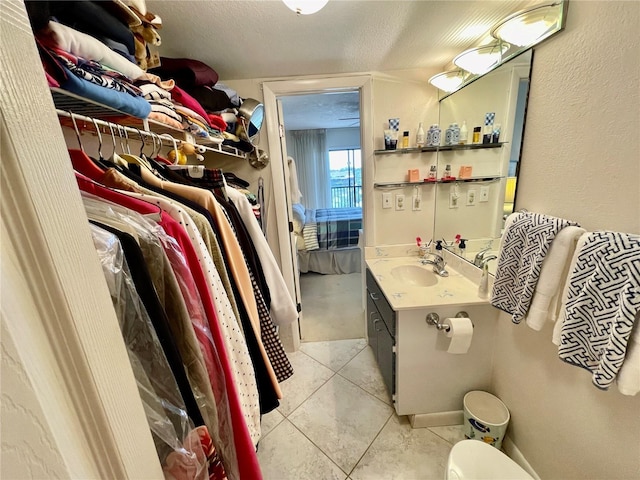 25188 Marion Ave Unit F304, Punta Gorda, FL 33950 - bathroom featuring tile patterned floors, toilet, and vanity