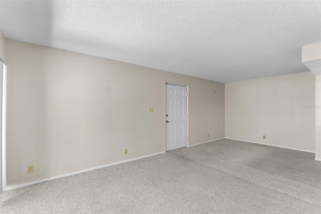 19505 Quesada Ave Unit A204, Port Charlotte, FL 33948 - spare room featuring a textured ceiling, carpet flooring, and baseboards