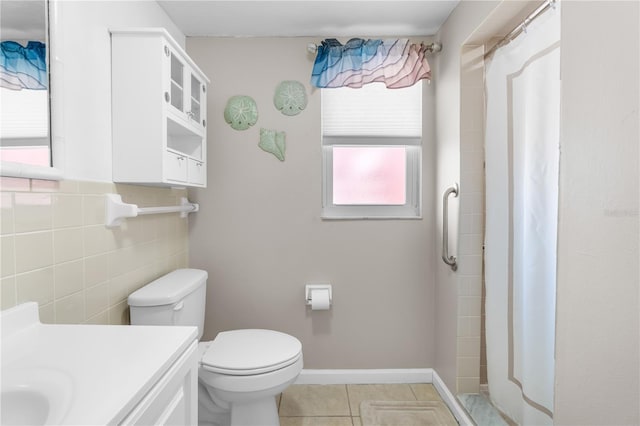 full bath featuring tile patterned flooring, vanity, toilet, tile walls, and a shower with curtain