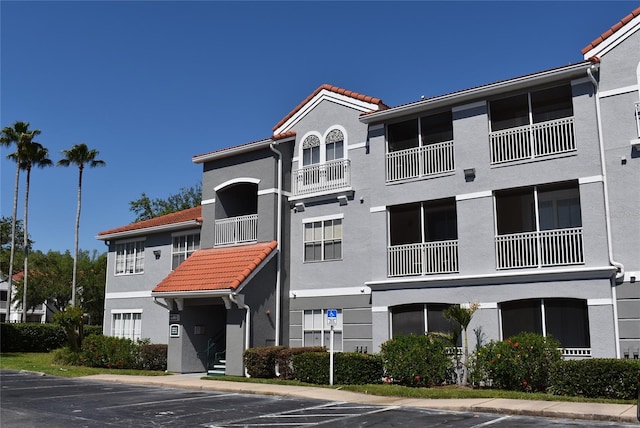 18001 Richmond Place Dr Unit 636, Tampa, FL 33647 - view of property featuring uncovered parking