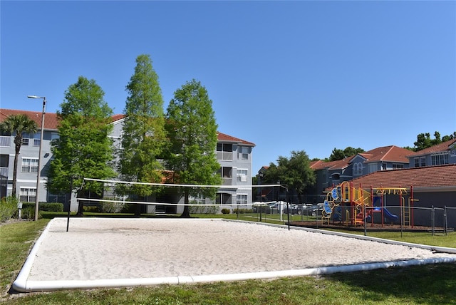 18001 Richmond Place Dr Unit 636, Tampa, FL 33647 - view of property's community featuring volleyball court, playground community, a residential view, and fence
