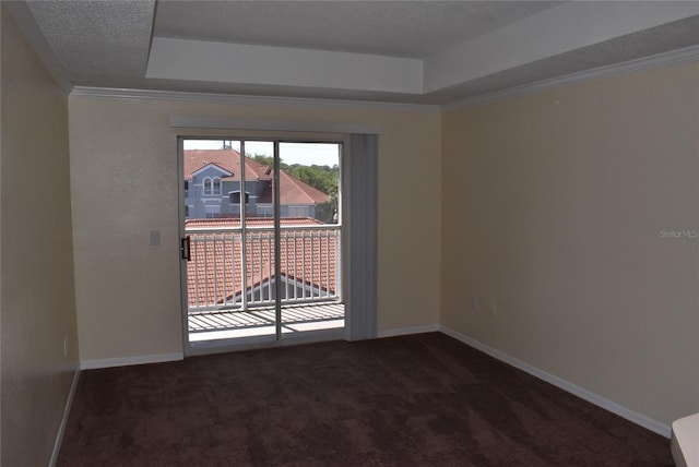 18001 Richmond Place Dr Unit 636, Tampa, FL 33647 - carpeted empty room featuring ornamental molding, a raised ceiling, and baseboards