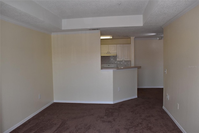 18001 Richmond Place Dr Unit 636, Tampa, FL 33647 - interior space featuring crown molding, a textured ceiling, dark colored carpet, and baseboards