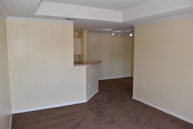 18001 Richmond Place Dr Unit 636, Tampa, FL 33647 - spare room featuring visible vents, a textured ceiling, crown molding, and carpet