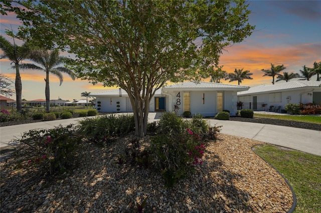 48 Hibiscus Dr, Punta Gorda, FL 33950 - view of front facade featuring curved driveway and fence