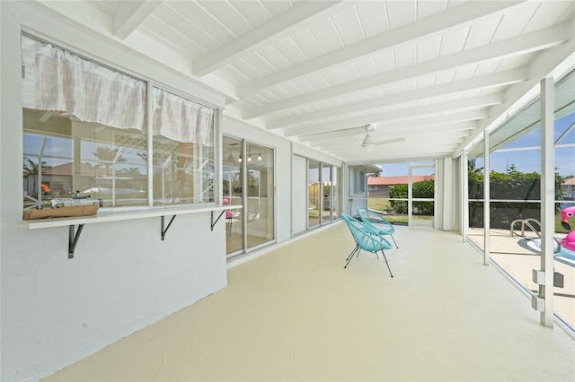 48 Hibiscus Dr, Punta Gorda, FL 33950 - unfurnished sunroom featuring beam ceiling, expansive windows, and wood ceiling