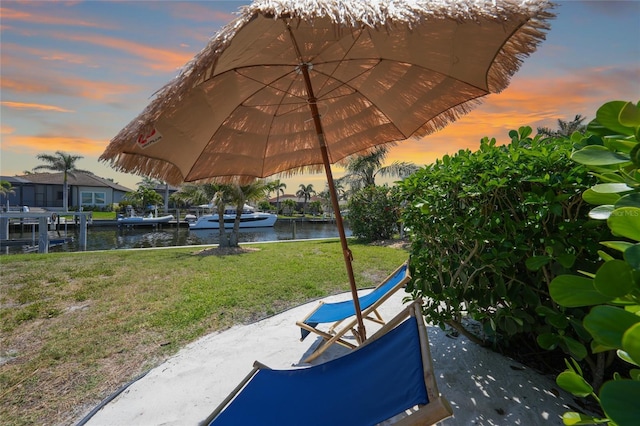 48 Hibiscus Dr, Punta Gorda, FL 33950 - view of home's community with a lawn and a water view