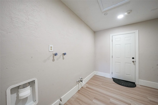 48 Hibiscus Dr, Punta Gorda, FL 33950 - laundry area featuring gas dryer hookup, light wood-style flooring, and baseboards