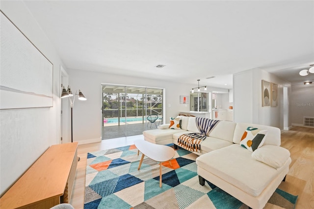 48 Hibiscus Dr, Punta Gorda, FL 33950 - living room with baseboards, visible vents, and light wood finished floors