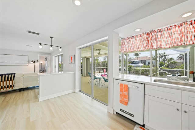 48 Hibiscus Dr, Punta Gorda, FL 33950 - interior space featuring a sink, plenty of natural light, dishwasher, and visible vents