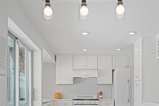 48 Hibiscus Dr, Punta Gorda, FL 33950 - kitchen featuring exhaust hood, white cabinets, freestanding refrigerator, and range with electric cooktop
