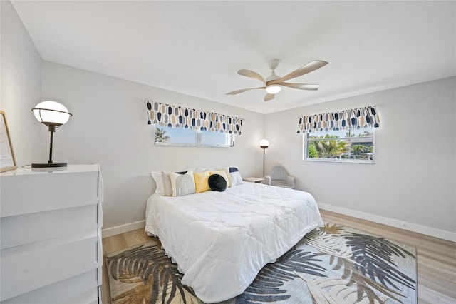 48 Hibiscus Dr, Punta Gorda, FL 33950 - bedroom featuring ceiling fan, wood finished floors, and baseboards