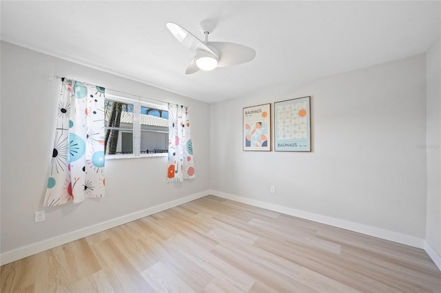 48 Hibiscus Dr, Punta Gorda, FL 33950 - spare room featuring ceiling fan, wood finished floors, and baseboards