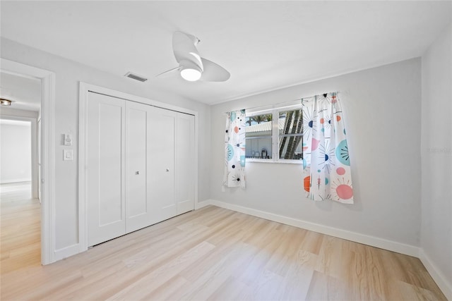 48 Hibiscus Dr, Punta Gorda, FL 33950 - unfurnished bedroom with wood finished floors, visible vents, baseboards, and a closet