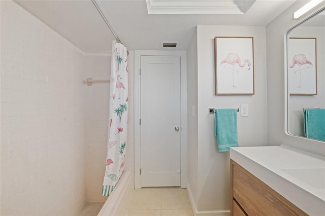 48 Hibiscus Dr, Punta Gorda, FL 33950 - full bathroom featuring vanity, a tile shower, visible vents, baseboards, and tile patterned flooring